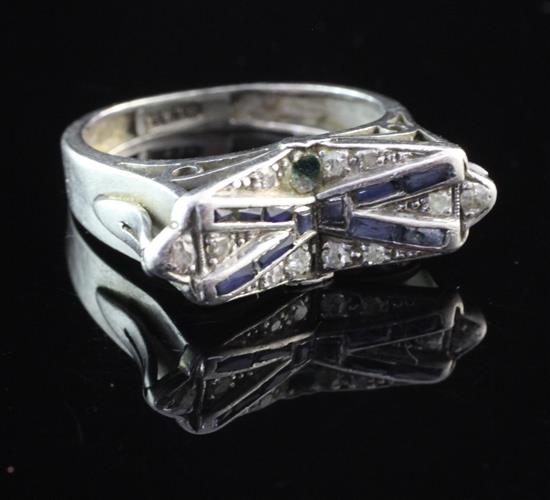 A stylish 1920s/1930s platinum, synthetic sapphire and diamond dress ring, size R.